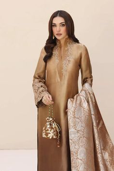 Luxury Bronze Shade Embroidered Pakistani Salwar Kameez Dupatta Suit Crafted with intricate dori work and hand-worked with a delicate tapestry of stones. Luxury Gold Banarasi Silk Salwar Kameez, Raw Silk Churidar With Dupatta, Luxury Bollywood Style Beige Kurta, Embroidered Tissue Silk Anarkali Set, Tissue Silk Dupatta With Dabka, Wedding Tussar Silk Churidar, Elegant Tussar Silk Straight Kurta, Unstitched Tissue Silk Salwar Kameez, Elegant Tussar Silk Kurta With Chikankari Embroidery