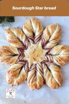 a star shaped pastry with the words sourdough star bread