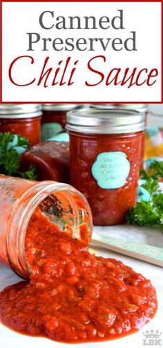 a jar filled with chili sauce sitting on top of a table