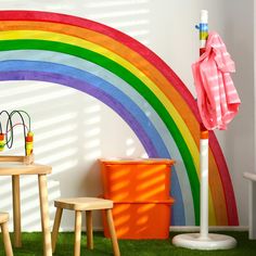 children's playroom with rainbow painted on the wall