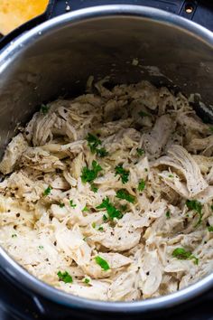 the food is being cooked in the pot on the stove