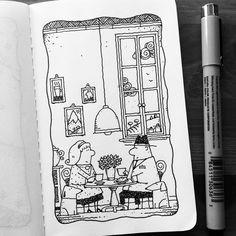 an open book with a drawing of two people sitting at a table in front of a window