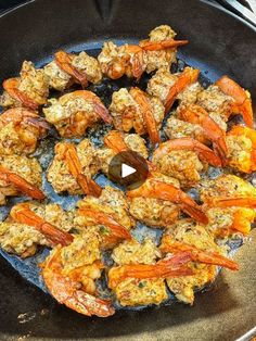 cooked shrimp and praws in a frying pan