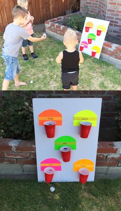 two children playing with an ice cream machine in the yard, and one is holding a plastic cup