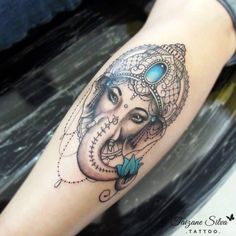 an elephant with a woman's face on it's head and blue eyes