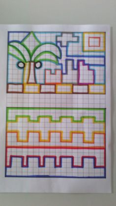 a piece of paper that has been drawn with colored squares and lines on the side