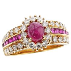 an 18k yellow gold ring set with pink sapphires and diamonds, circa 1970