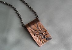 This copper pendant was textured, and painted with a patina, and hung on a antique color copper chain with spring clasp. It is coated in a non-yellowing jewelers lacquer to maintain the patina. The chain is 18 inches long. The pendant is over 1 1/4 inches long and 3/4 inches wide. Copper Clay Jewelry, Valley Aesthetic, Copper Clay, Metal Art Jewelry, Art Atelier, Chainmail Necklace