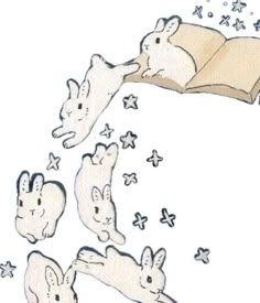 an image of rabbits reading a book with stars coming out of the top and bottom