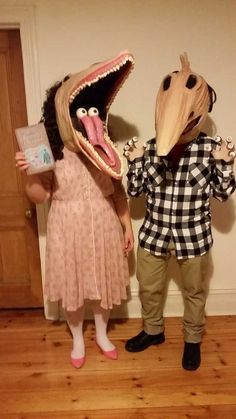 two people in costumes standing next to each other