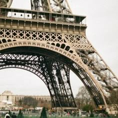 the eiffel tower is very tall and has many people walking around in it