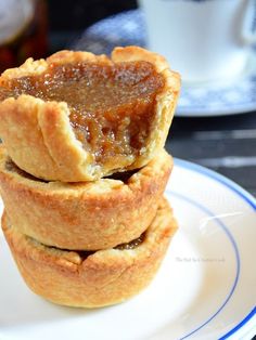 three mini pies stacked on top of each other with jam in the middle,