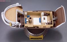 a model of a boat with furniture and accessories on it's deck, from above