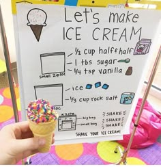 an ice cream sign in front of a child's play area