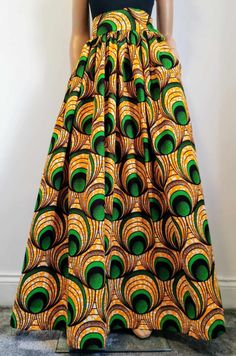 Handmade Unlined African Print Maxi / Full-Length Skirt     Elastic waistband skirt at the back     2 open side-entry pockets     Length: 46" (adjustable)     100% Wax Cotton     Handmade     Made in the UK (Colours may vary due to lighting on images. The product images are closest to the true colour of the product.) African Skirt, Maxi Rock, Elastic Waistband Skirt, Full Length Skirts, Handmade Uk, Printed Maxi, Waxed Cotton, Product Images, African Print