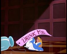 a cartoon character holding a pink sign with the words drink me on it and an air blower