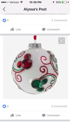 a white ornament with red and green decorations on it's side, in the middle of an instagram post