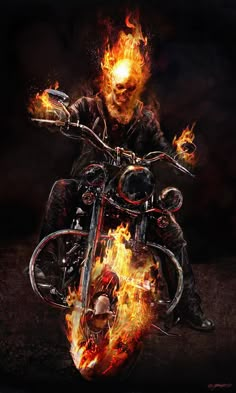 a man riding on the back of a motorcycle in flames