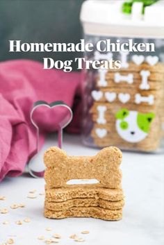 a stack of dog biscuits next to a container of oatmeal and peanut butter