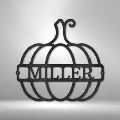 a metal pumpkin with the word miller on it's front and back letters are cut out