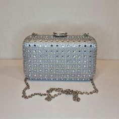 Womens silver crystal evening clutch bag with silver, crystal embellished top closing clasp Can be used with or without long shoulder chain (included) size approx- H 11cm x W 18cm Free Royal Mail delivery is an estimated 3-5 days but this can occasionally be slightly longer which solely on the Royal Mail side. We do offer guaranteed next day delivery but please contact us prior to ordering as this would incur a small upgraded shipping charge. We also offer WORLDWIDE shipping - please contact us Mail Delivery, Quality Handbags, Shoulder Chain, Embellished Top, Silver Crystal, Evening Clutch Bag, Gorgeous Bags, Evening Clutch, Small Purse