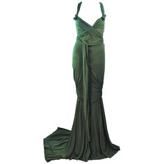 This Elizabeth Mason Couture gown is composed of bamboo jersey. Features a wrap style with a drop neckline. may be fashioned in a variety of colors. The gown may be fashioned in a variety of colors. This is a couture custom order. Please allow for a 60 day lead time from measurements, fabric selection, patterning, toile fitting, to final product. The dress shown is a sample size 2. The sample is not for purchase. Measurements of sample size: Length: 55" +10" Train Bust: 30" Waist: 26" Hip: 38" Black Dinner Dress, Blue Velvet Gown, White Jersey Dress, Drapey Dress, Jersey Evening Dress, Vintage Evening Gowns, Gowns Black, Draped Gown, White Evening Gowns