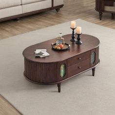 a coffee table with candles on it in a living room