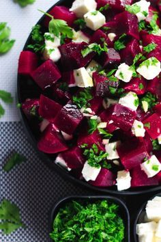 beetroot and feta salad in black bowls with text overlay reading healthy beetroot and feta salad easy + super delicious