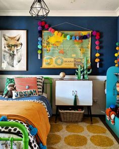 a bedroom with blue walls and colorful decorations