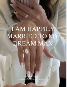 a woman holding a cell phone in her right hand with the words i am happily married to my dream man