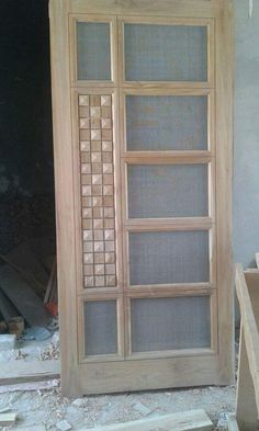 a wooden door with glass inserts on it