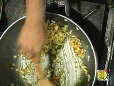 someone is cooking food in a pan on the stove