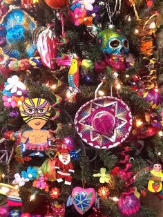 a christmas tree decorated with brightly colored ornaments