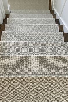 carpeted stairs leading up to the first floor