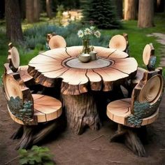 a table and chairs made out of tree stumps in the woods with flowers on top