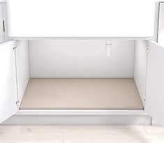 an empty white refrigerator with the door open and no one in it's place