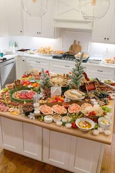 a kitchen island filled with lots of food