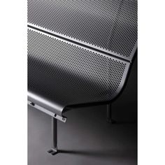 a metal bench with perfored backrests on it's sides and legs