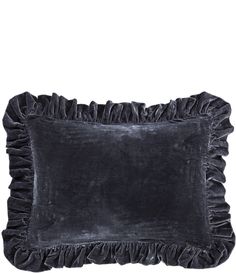 a black velvet pillow with ruffled edges