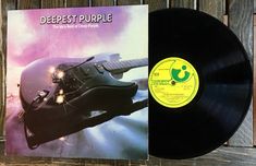 a record with an image of a guitar on the front and back cover, which reads deepest purple