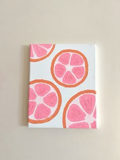 an orange and pink painting on a white wall