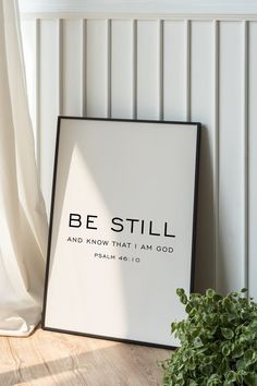 a framed poster with the words be still and know that i am god on it