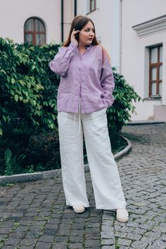 Linen button up shirt for women, lilac edwardian blouse, cottagecore blouse plus size.  Our reinterpreted classic shirt has a modern touch, it is timeless and super comfy for the body. The linen blouse will help create an elegant image for the office or easy and relaxed for a walk. DETAILS The shirt is designed for a loose fit! ◾collared linen shirt, features chest pockets, button down the front and a double-layered yoke with pleats at the back; ◾dropped shoulders, long sleeves with buttoned cuffs; ◾ the item has high-quality tailoring and neat seamy side. It designed and made to be timeless. The minimalist cut promotes convenience and ease. ◾ the fabric doesn't shrink. It doesn't sheer; ◾shown in a lilac colour SIZING TIP: ◾ Check your measurements to choose the best size for you and refe Summer Workwear Lavender Blouse, Summer Lavender Blouse For Workwear, Lavender Blouse For Summer Workwear, Lavender Summer Workwear Blouse, Lilac Button Down Shirt Outfit, Feminine Relaxed Fit Blouse With Buttons, Purple Relaxed Fit Blouse For Daywear, Elegant Relaxed Fit Blouse With Pockets, Casual Lavender Blouse For Daywear