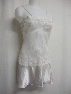 "Short White Lace and Satin Nightgown Unbelievably adorable! Sheer Baby doll /white nightie! Tons of lace with a satin flouncy skirt This is sassy! (Like You!) Small 36\" bodice 40\" Hip 32\" length Easy care poly GREAT for brides! https://www.etsy.com/shop/BelindasStyleShop" Lace Nightgown Camisole For Night, Sheer Lace Sleepwear For Wedding Night, Coquette Lace Nightgown For Bedtime, Lace Camisole Nightgown, Lace Patchwork Sleepwear For Wedding Night, Wedding Night Lace Sleepwear With Lace Patchwork, Lace Camisole Nightgown For Sleep, Sheer Lace Sleepwear For Bedtime, Sheer Lace Sleepwear