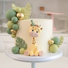 a cake with a giraffe decoration on it