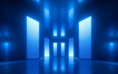 an empty room with blue light coming through the doors