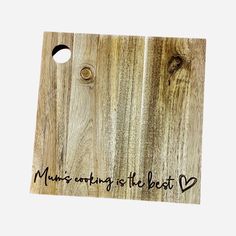 a wooden cutting board with the words music going is the best written on it and two holes in the wood