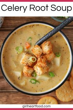 a bowl of soup with crackers and vegetables