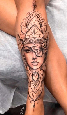 a woman's leg with a tattoo on it