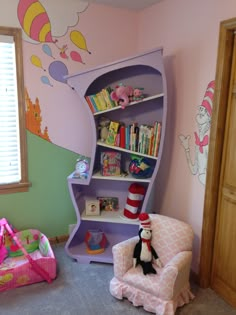 a child's room with a cat in the hat book shelf